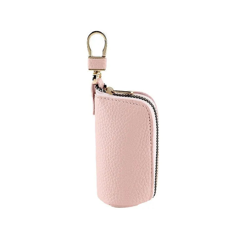Men's fashion simple black PU leather zippered key ring case on a grey background.