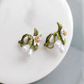 Women's contrast colour floral earrings with sterling silver needle detailing and alloy flower ear clip