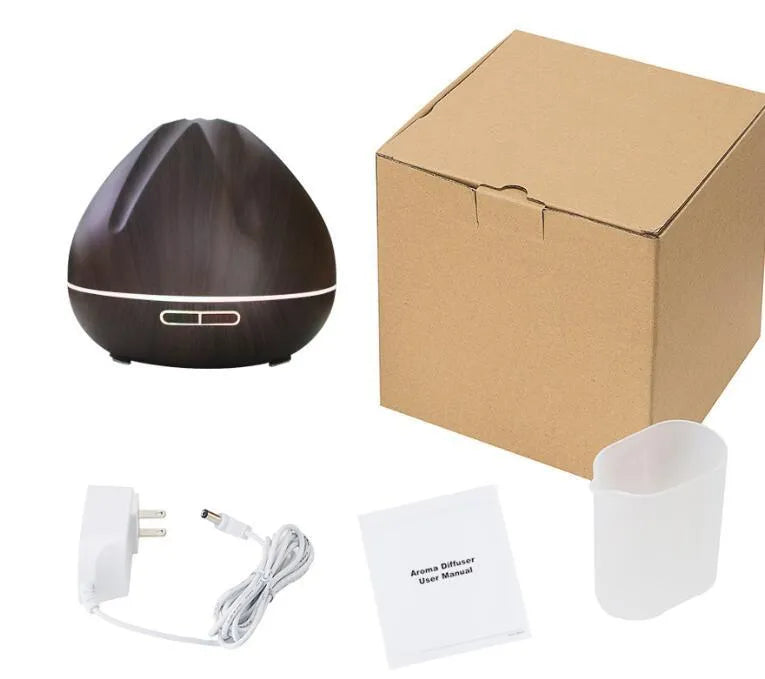 Air humidifier aromatherapy machine with 500ml capacity in dark wood finish on a table