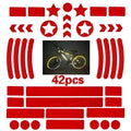 Reflective bicycle safety tape with a geometric grid pattern, shown in red, yellow, blue, and white colours.