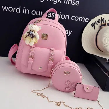 Women's 3-piece floral leather bag set showing backpack, shoulder bag, and card purse