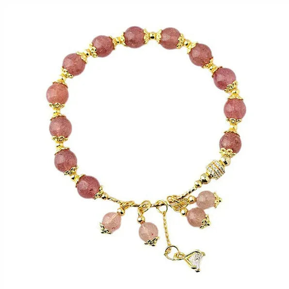 Women's pink crystal bracelet with heart-shaped design and pearl accents in strawberry quartz colour