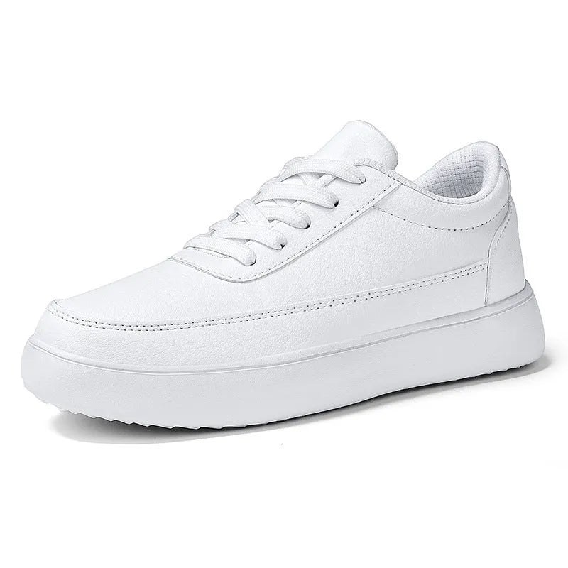 Women's white leather lace-up flat casual shoes on a solid background.
