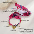 Stainless steel geometric love pendant necklace and matching bracelet set with 18K gold electroplated finish.