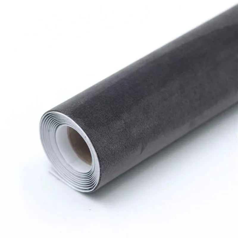 Rolls and sheets of coloured self-adhesive suede leather material for DIY projects.
