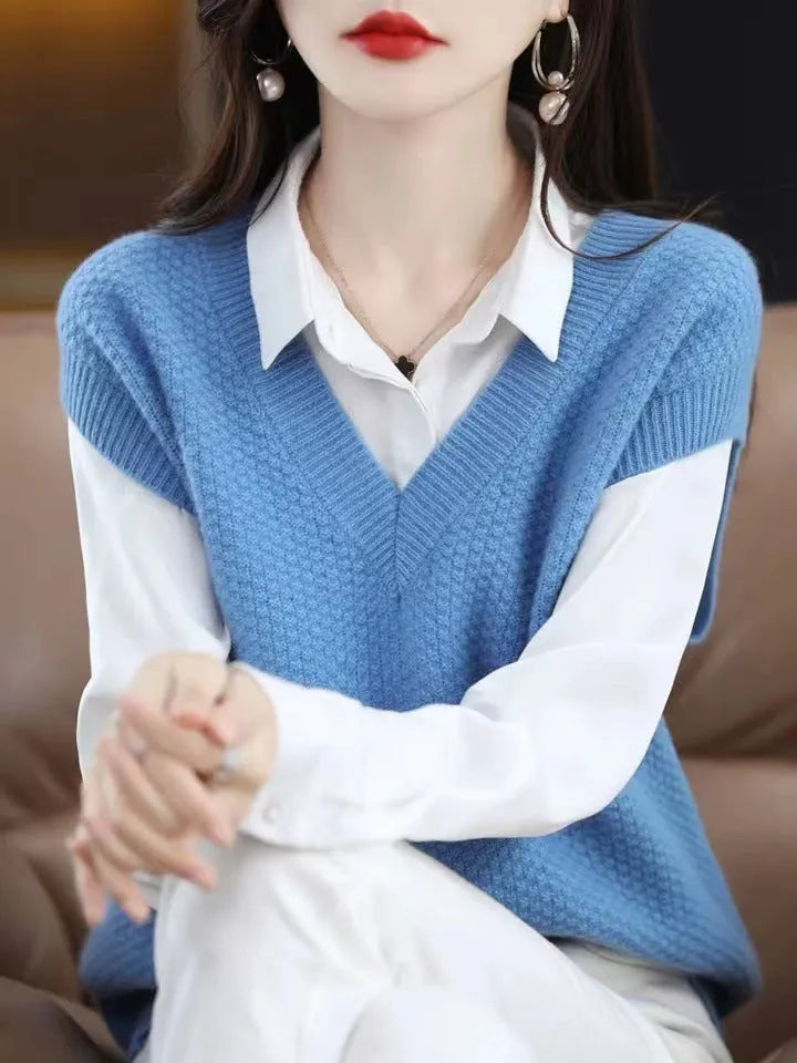 Women's creamy-white V-neck sleeveless knitted vest with a textured 3D pattern on a hanger.