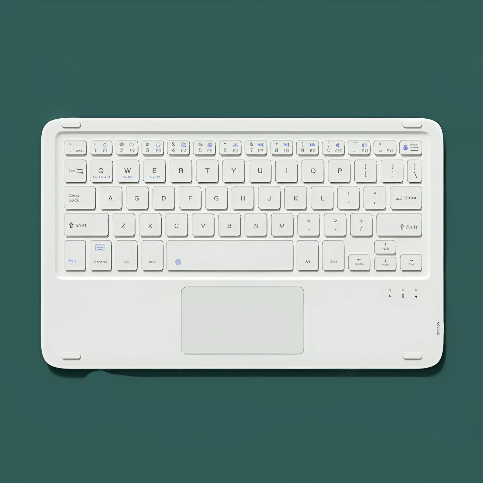 Pink Bluetooth touch keyboard and rechargeable wireless mouse on a desk next to a tablet.