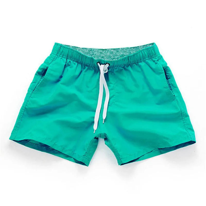 Men's straight leg polyester board shorts on a hanger, available in multiple colours and plus sizes.
