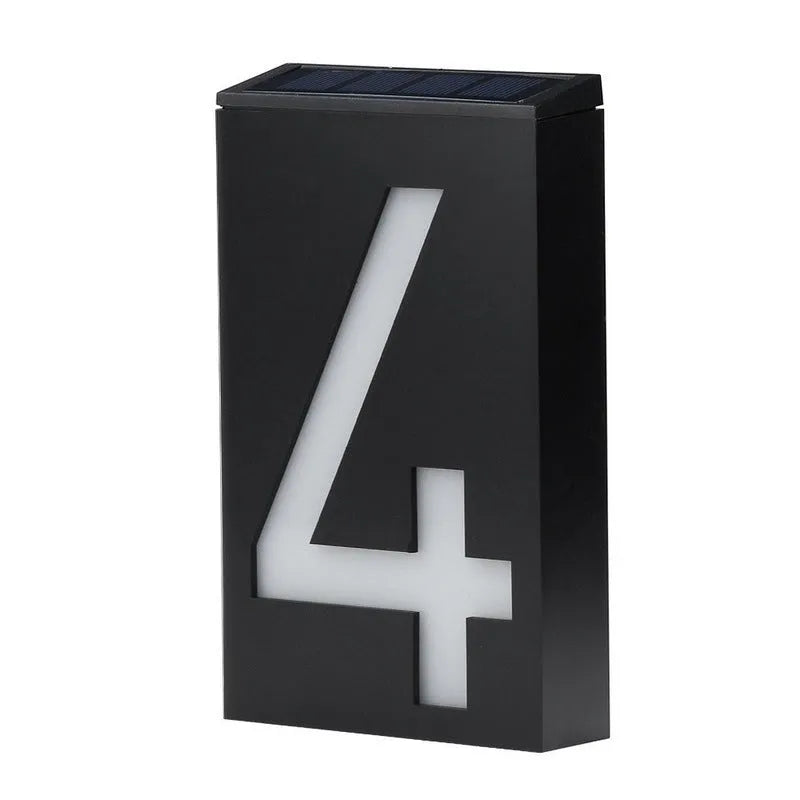 Solar powered outdoor house number light with white LEDs and wall mount.