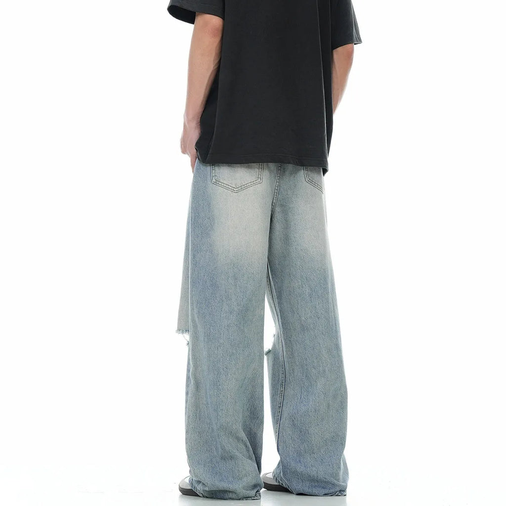 Blue men's straight-leg ripped jeans with a cotton blend fabric and zipper fly.