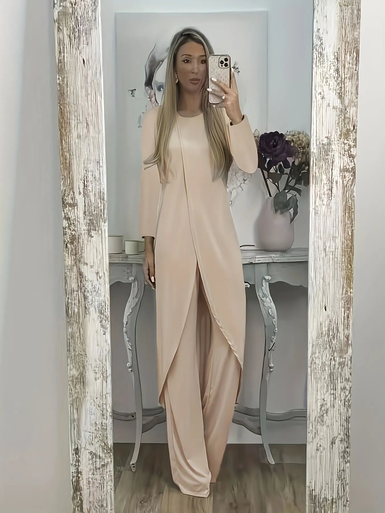 Casual black polyester two-piece lounge set with long sleeve top and loose trousers on a hanger.