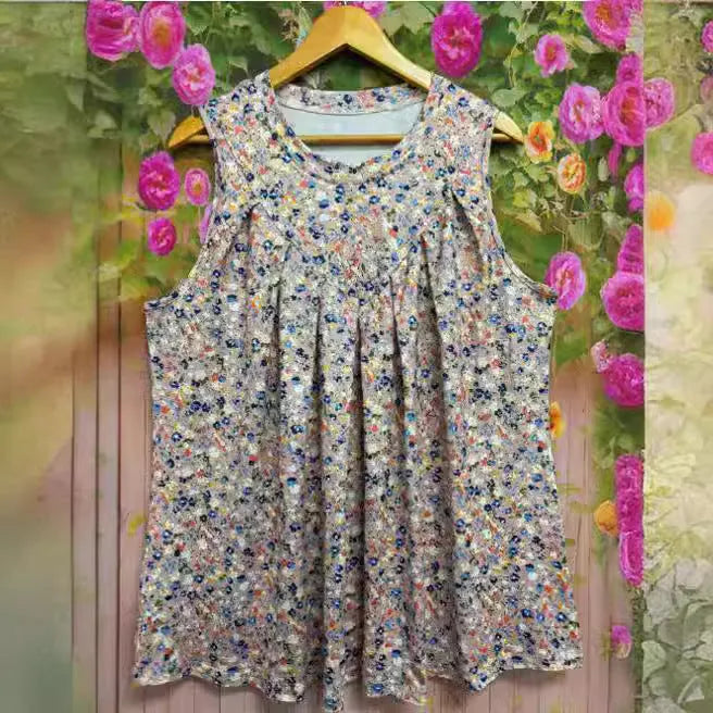 Black plus size floral print sleeveless vest with round neck on a mannequin.