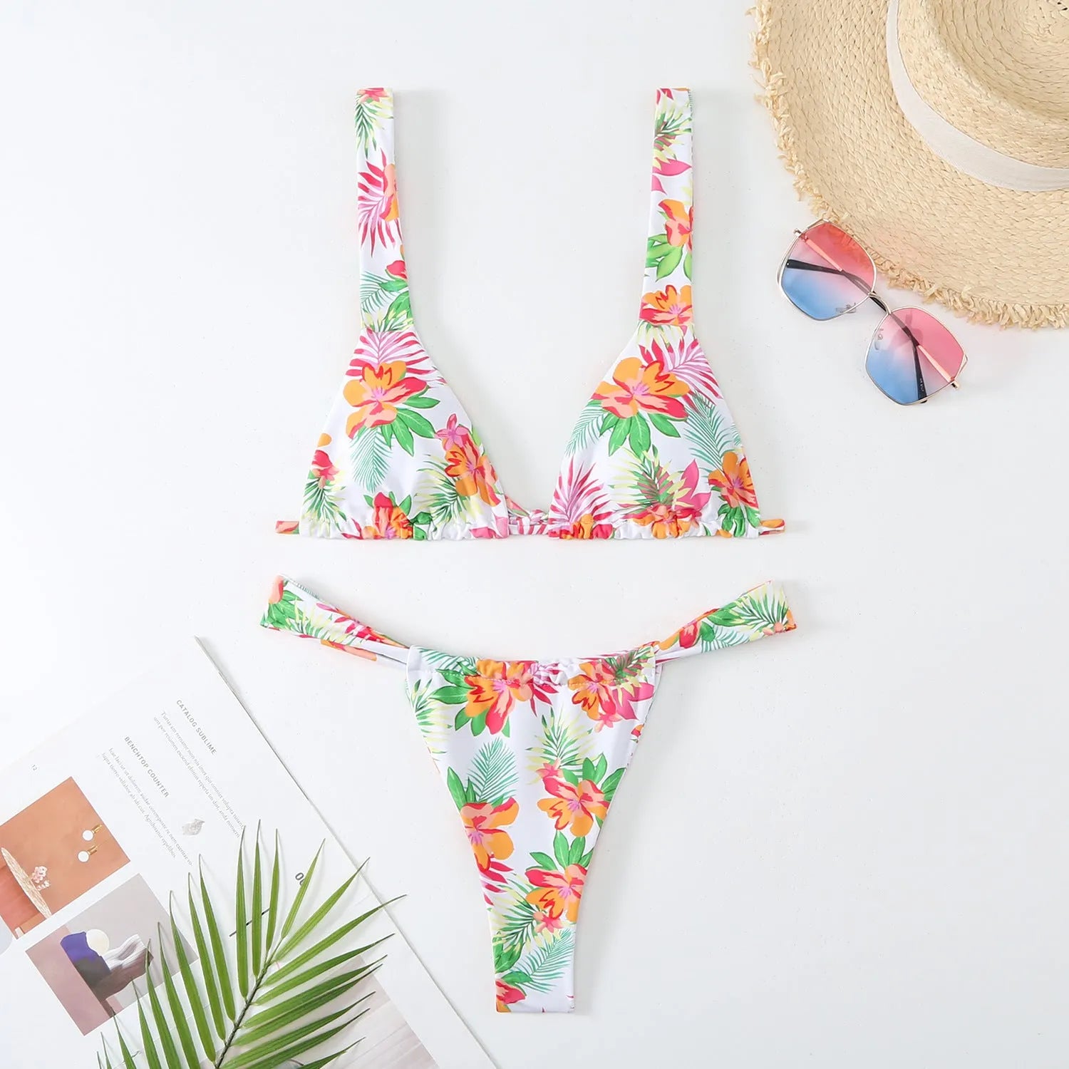 Women's floral print bikini swimsuit in blue, rose red, sky blue, or white colour.