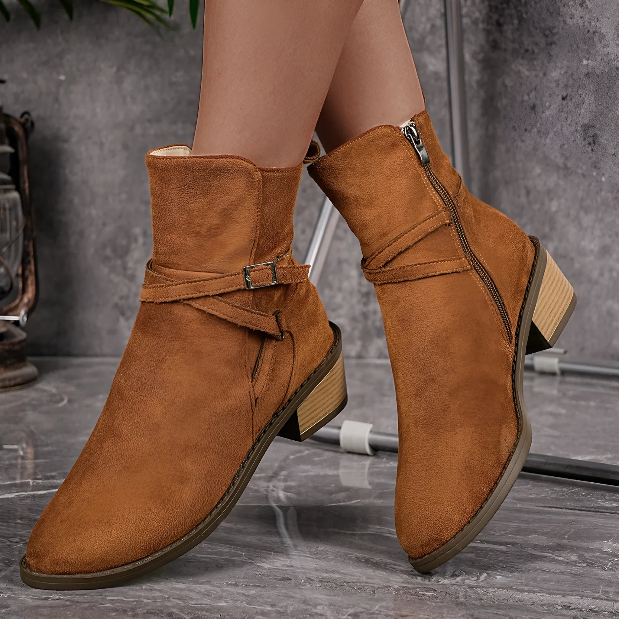 Women's suede ankle boots with cross-strap and side zipper, mid-heel, available in black and camel