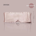 Mulberry silk sleep eye mask shown in champagne gold colour, laid flat on a surface.