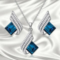 Women's alloy and glass necklace with matching ear stud set featuring cross chain design