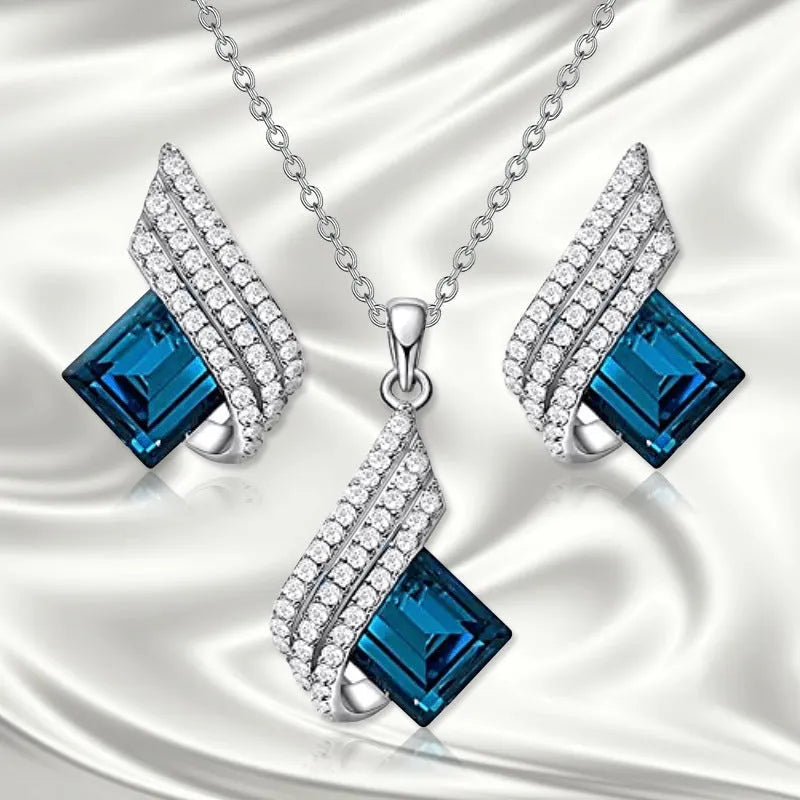Women's alloy and glass necklace with matching ear stud set featuring cross chain design