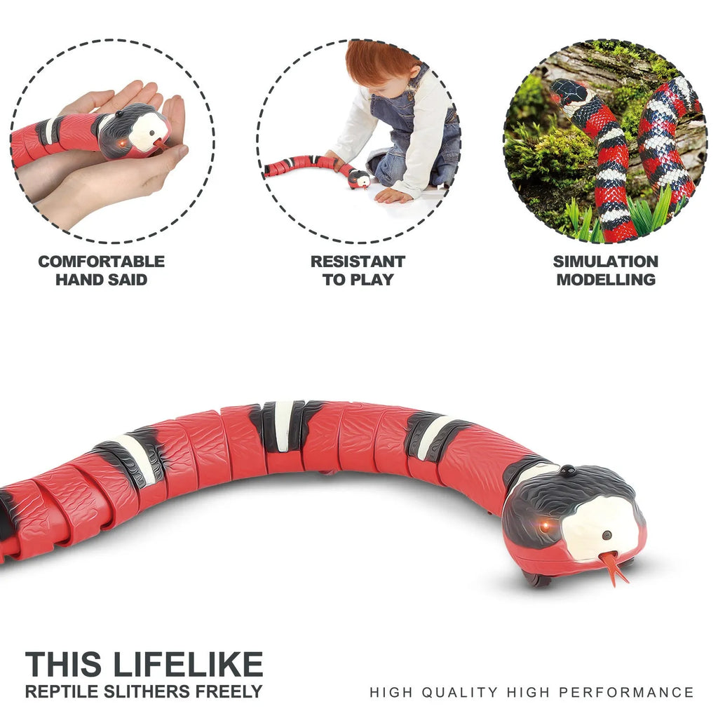Smart sensing interactive electronic snake cat toy on a floor, showing segmented plastic body and USB charging port.
