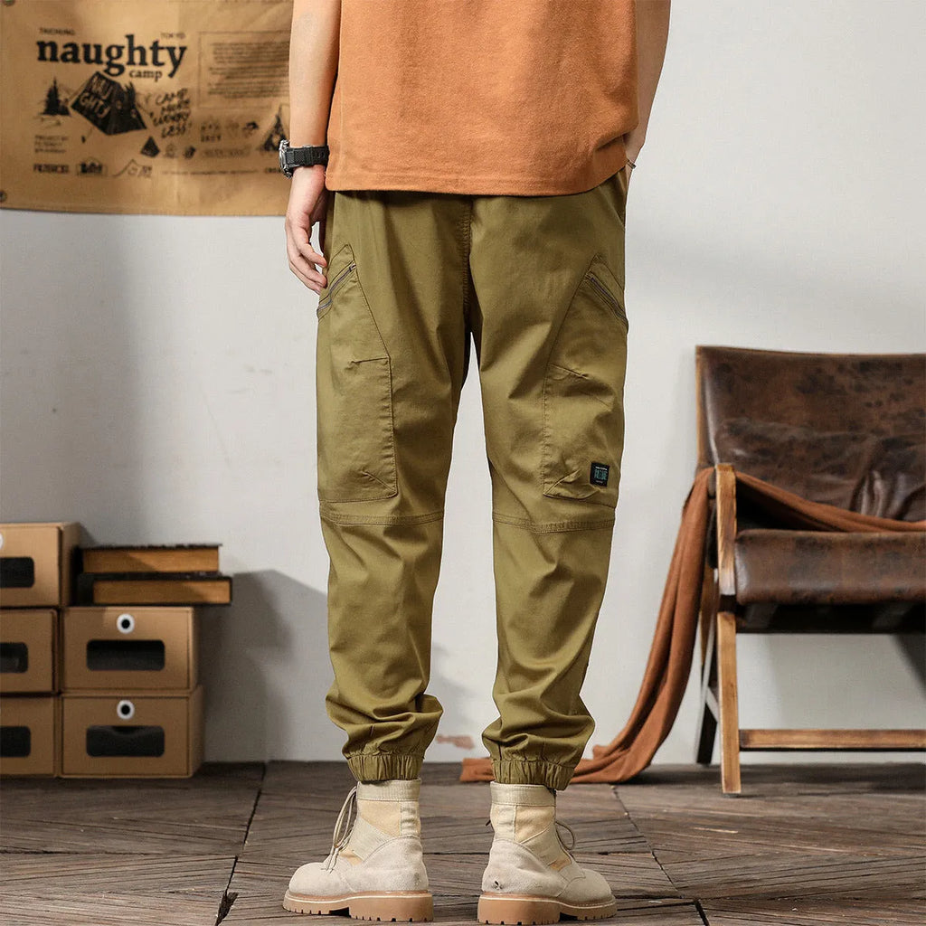 Men's Korean style tapered harem pants in cotton with small leg opening and mid-waist design