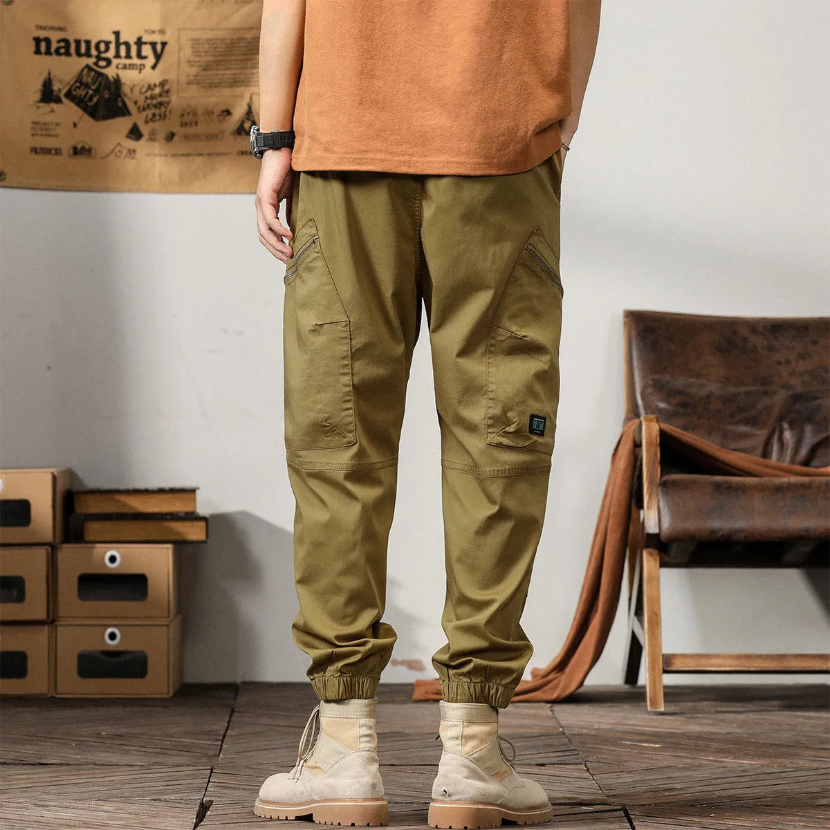 Men's Korean style tapered harem pants in cotton with small leg opening and mid-waist design