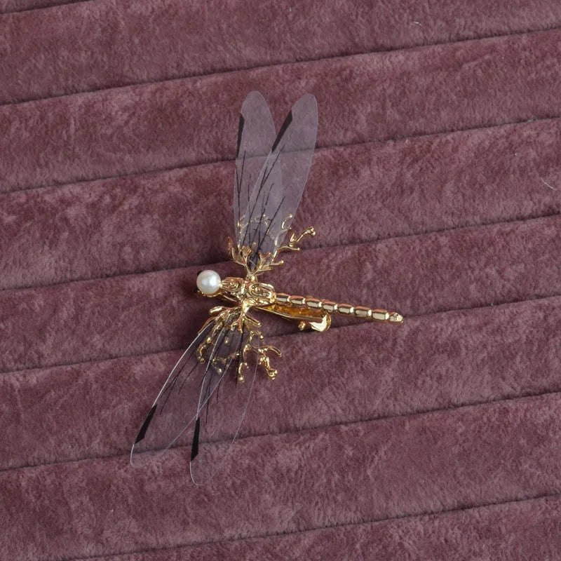 Golden dragonfly-shaped side clip headdress for women's hair, made from alloy with an electroplated finish.