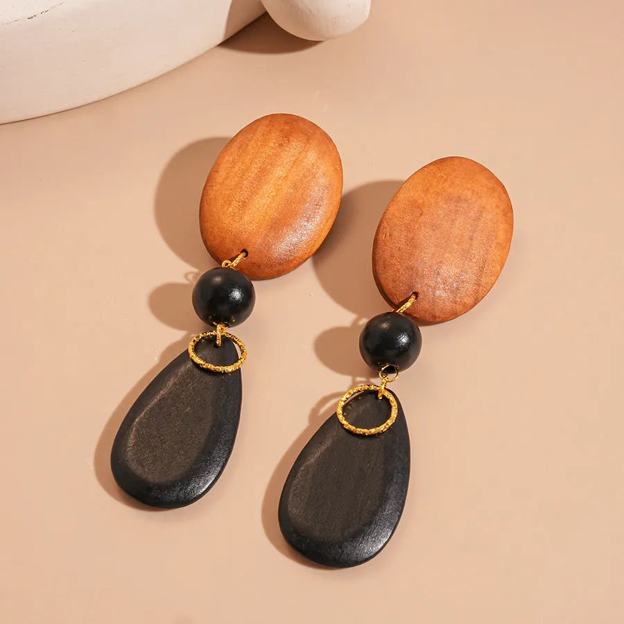 Wooden handmade retro fashion earrings with ellipse shape and brown-black colour combination