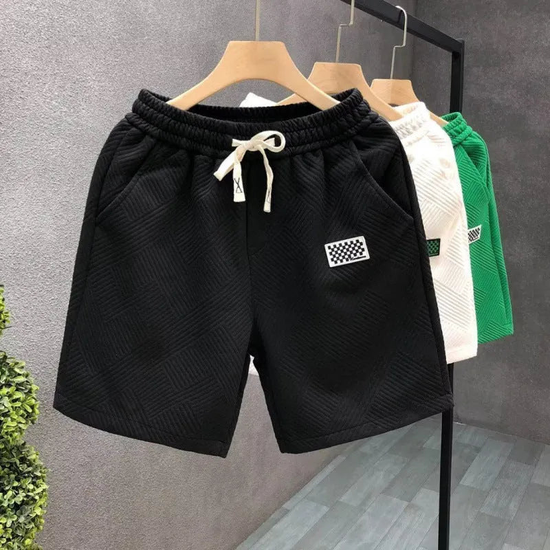 Casual solid-colour polyester sports shorts with micro elasticity on a mannequin.