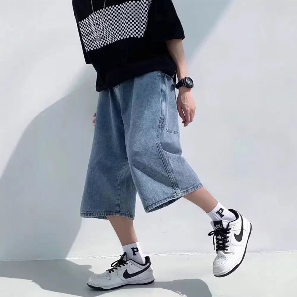 Men's washed light blue denim pirate shorts with a high waist and straight cropped legs on a plain background.