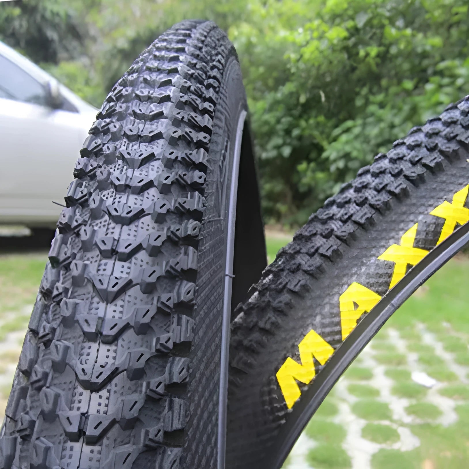 Ultralight puncture-proof mountain bike tyre shown in black with white label sidewall option.