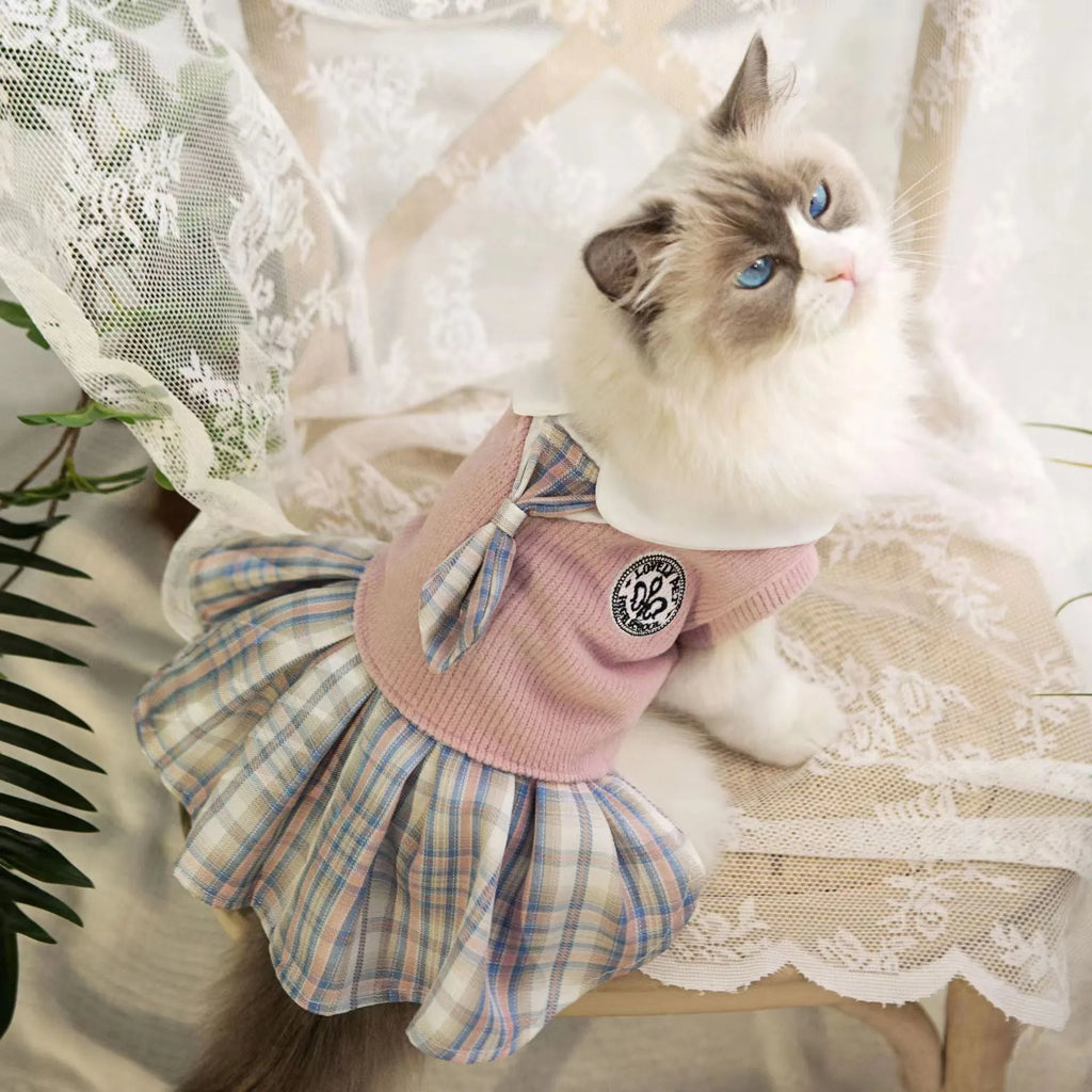 A pink, blue, or green tartan skirt for small dogs or cats in a princess costume style.