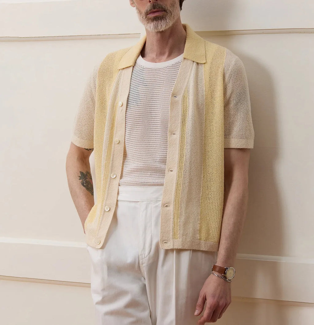 Yellow men's casual polo shirt with hollow-out detailing and an asymmetric short sleeve hem.