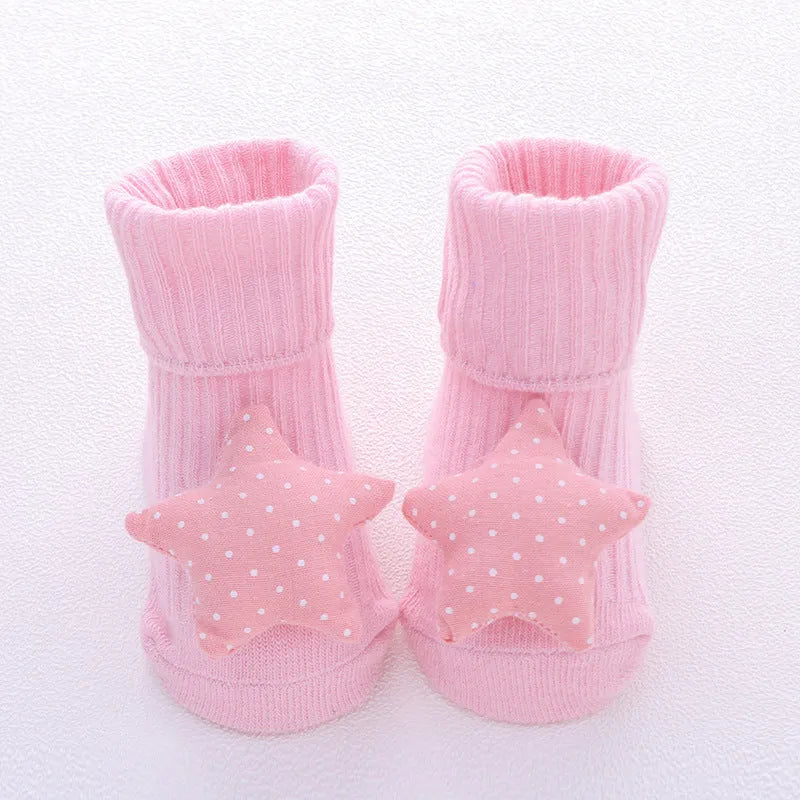 Cotton baby floor socks in various colours and patterns with size guide for ages 0-3 months