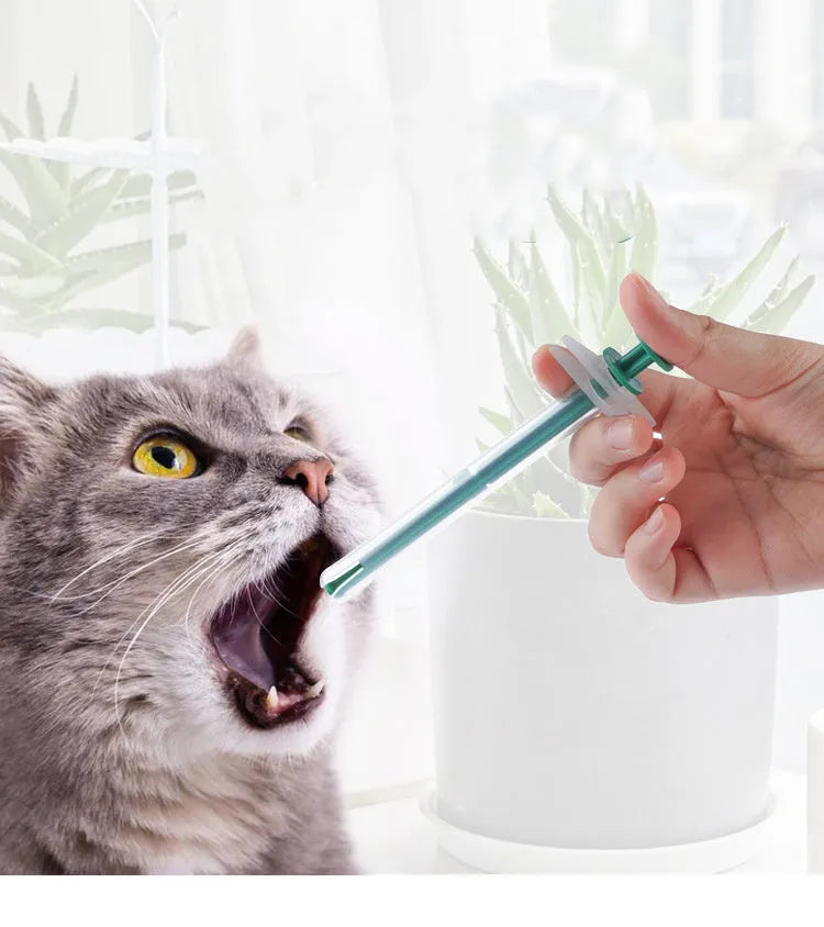 Two silicone pet pill shooter syringes with soft tips, one longer than the other, for administering tablets.