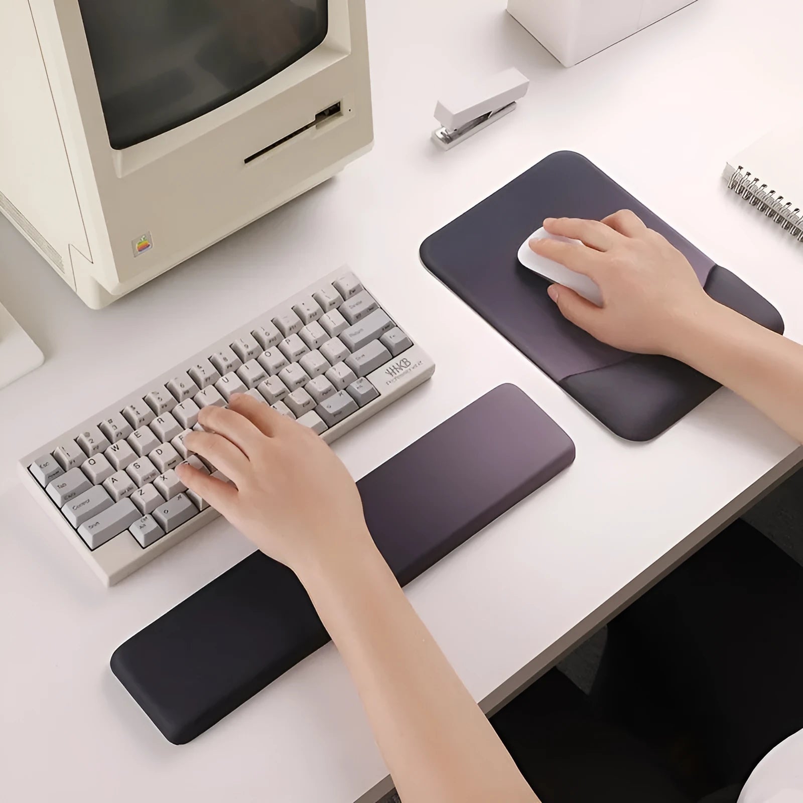 Square silica gel wrister mouse pad with cloth surface showing colour options including black, blue, pink and purple