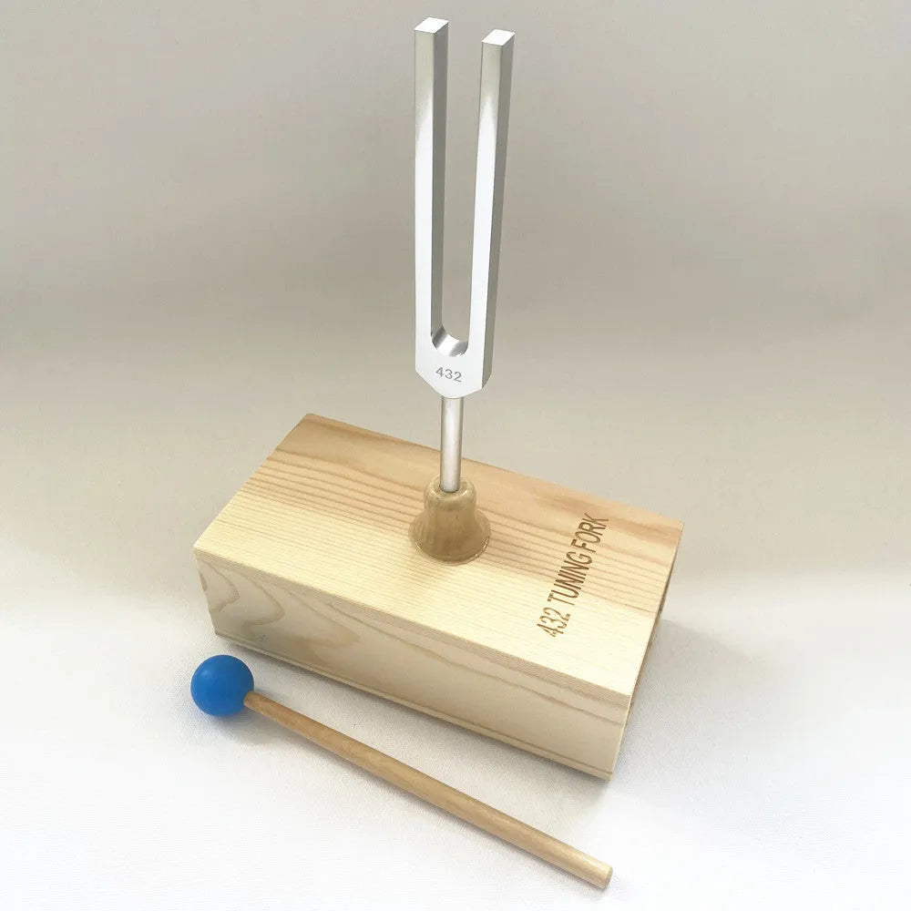 Aluminium alloy 432Hz tuning fork with acoustic speaker on kraft paper background