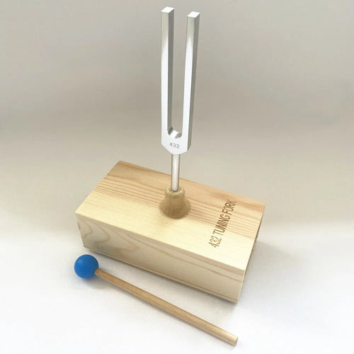 Aluminium alloy 432Hz tuning fork with acoustic speaker on kraft paper background