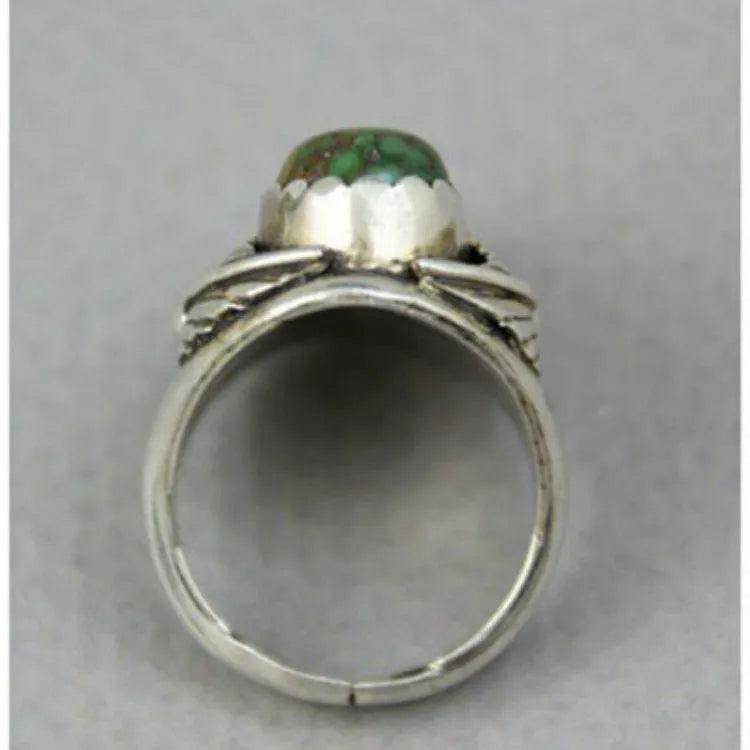 Geometric turquoise-coloured alloy ring for women on a grey background.