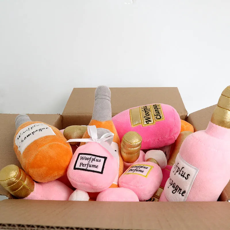 Plush wine bottle pet toy in assorted colours including green, orange, red, black and white.