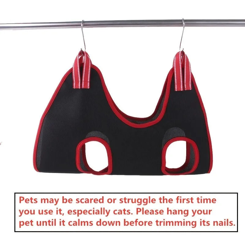 Mesh pet grooming hammock restraint bag hanging in a doorway for cat nail trimming or bath time.