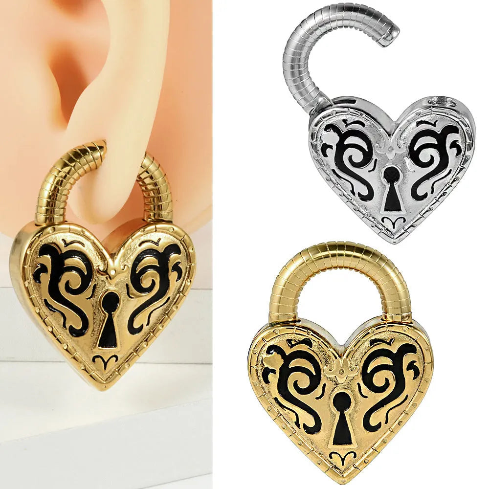 Heart-shaped stainless steel ear piercing stud with electroplated gold finish on white background