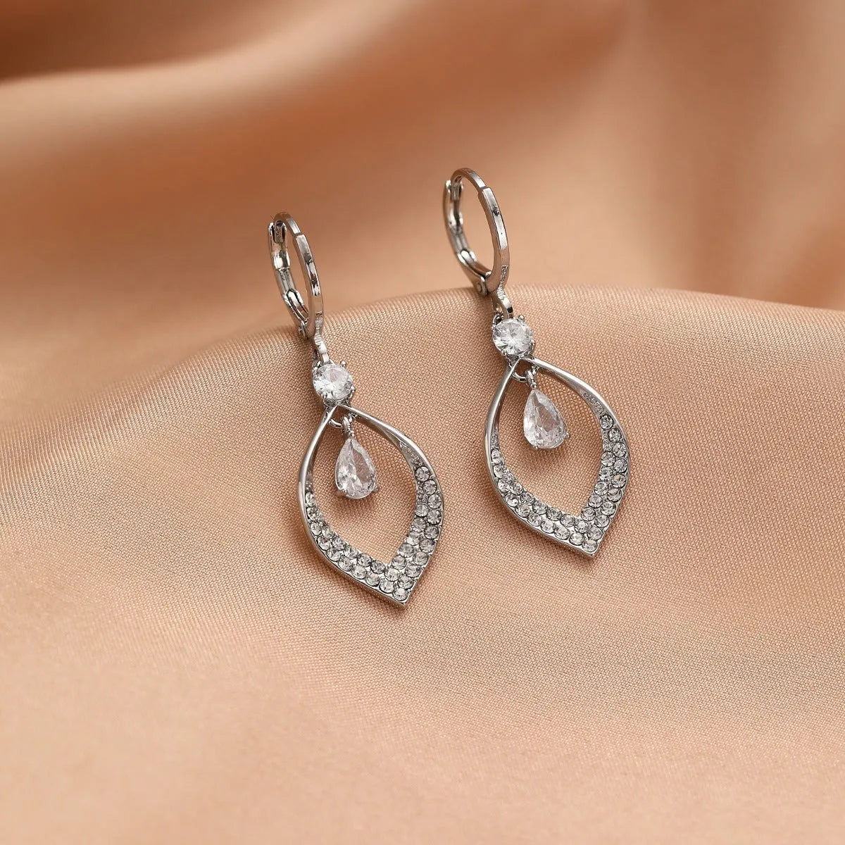 Gold and silver zircon teardrop tassel drop earrings on a copper base.