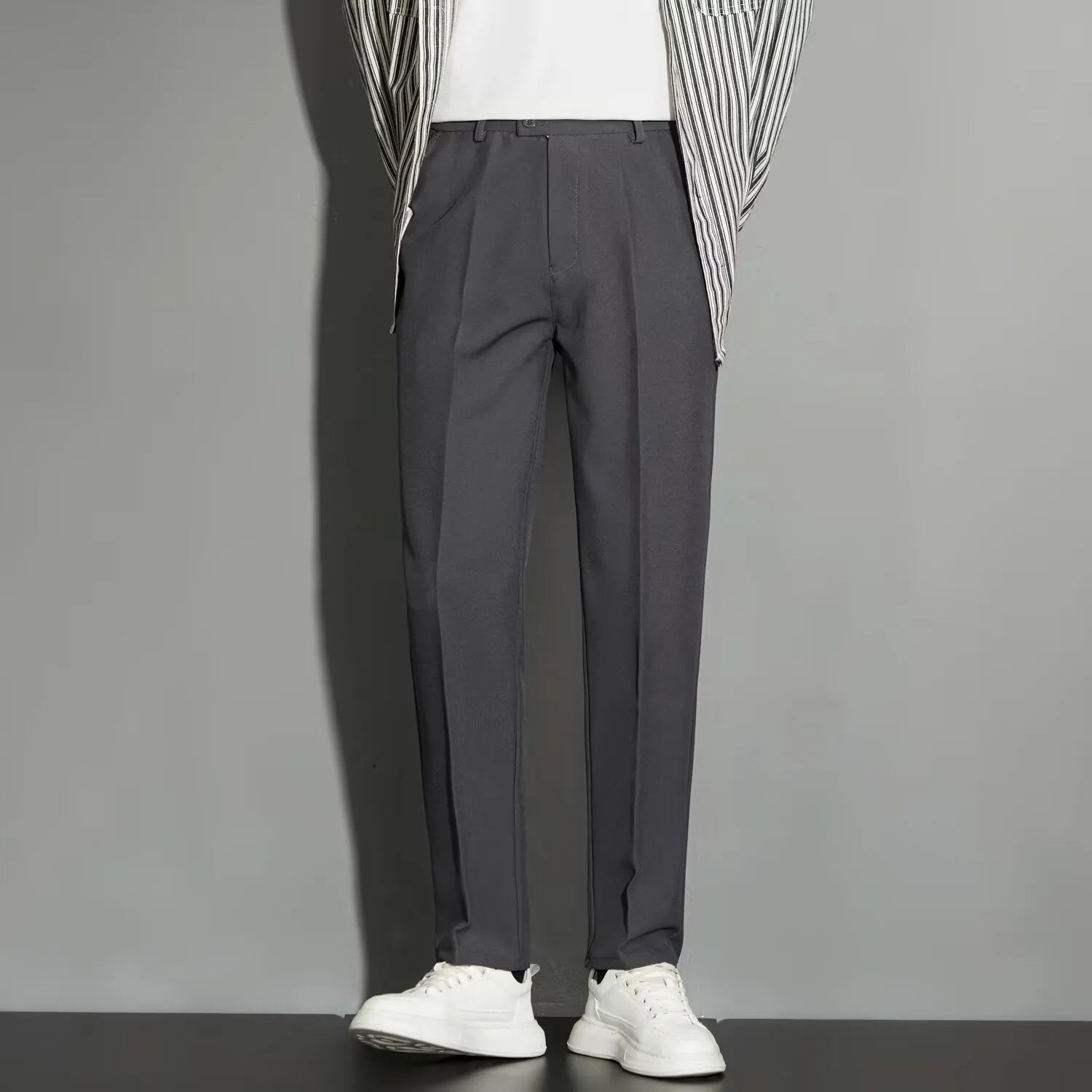 Men's straight leg ankle-length suit trousers in apricot colour on a model