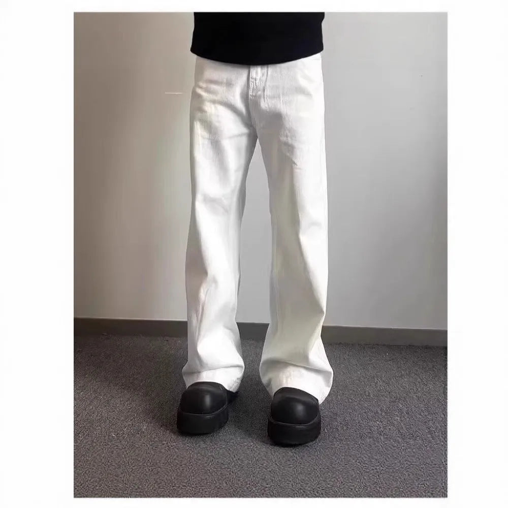 Men's white straight-leg denim jeans with a mid waist and zipper fly on a neutral background.