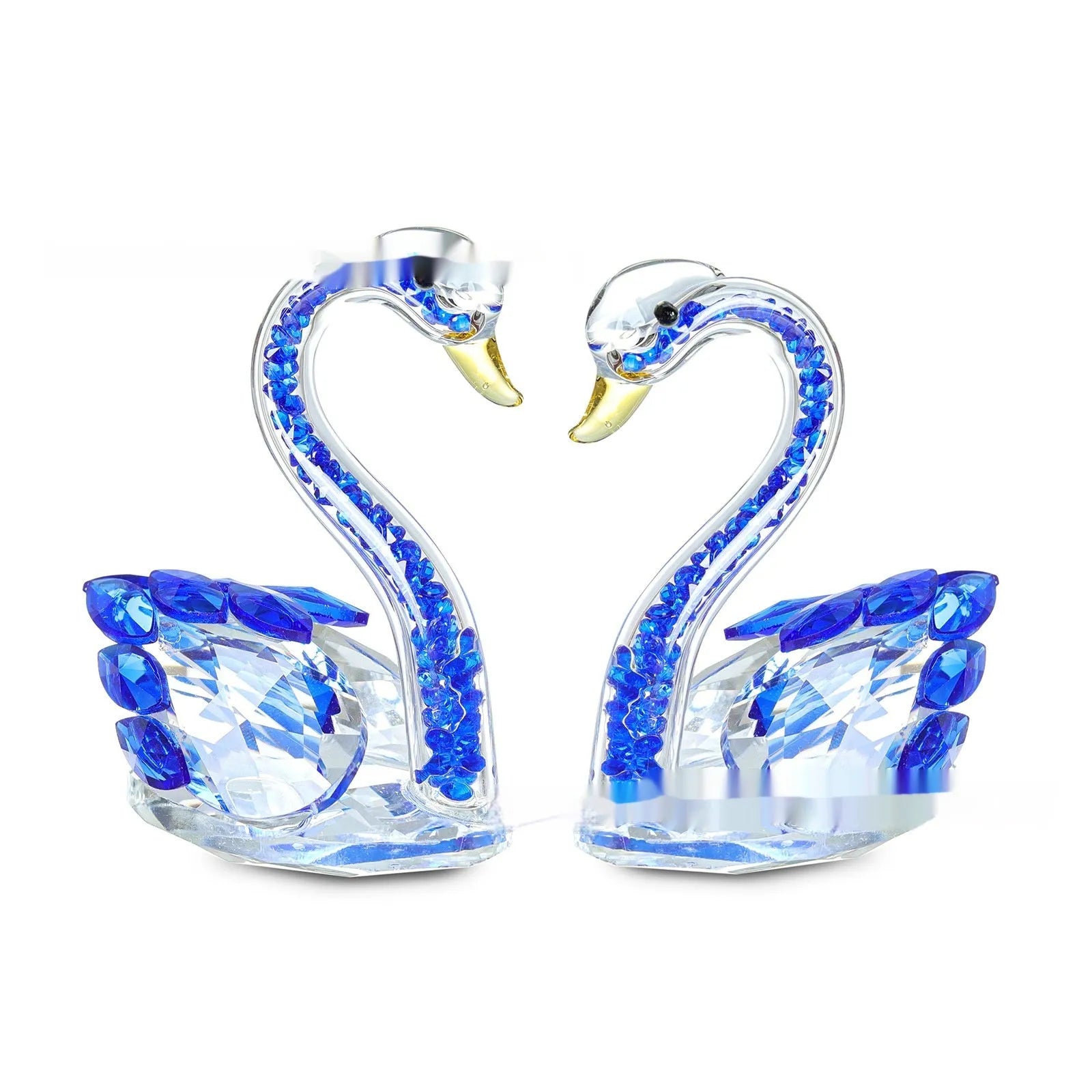 White crystal swan ornament on a desktop, shown in solid head and empty tube styles in red, blue, pink, and purple.