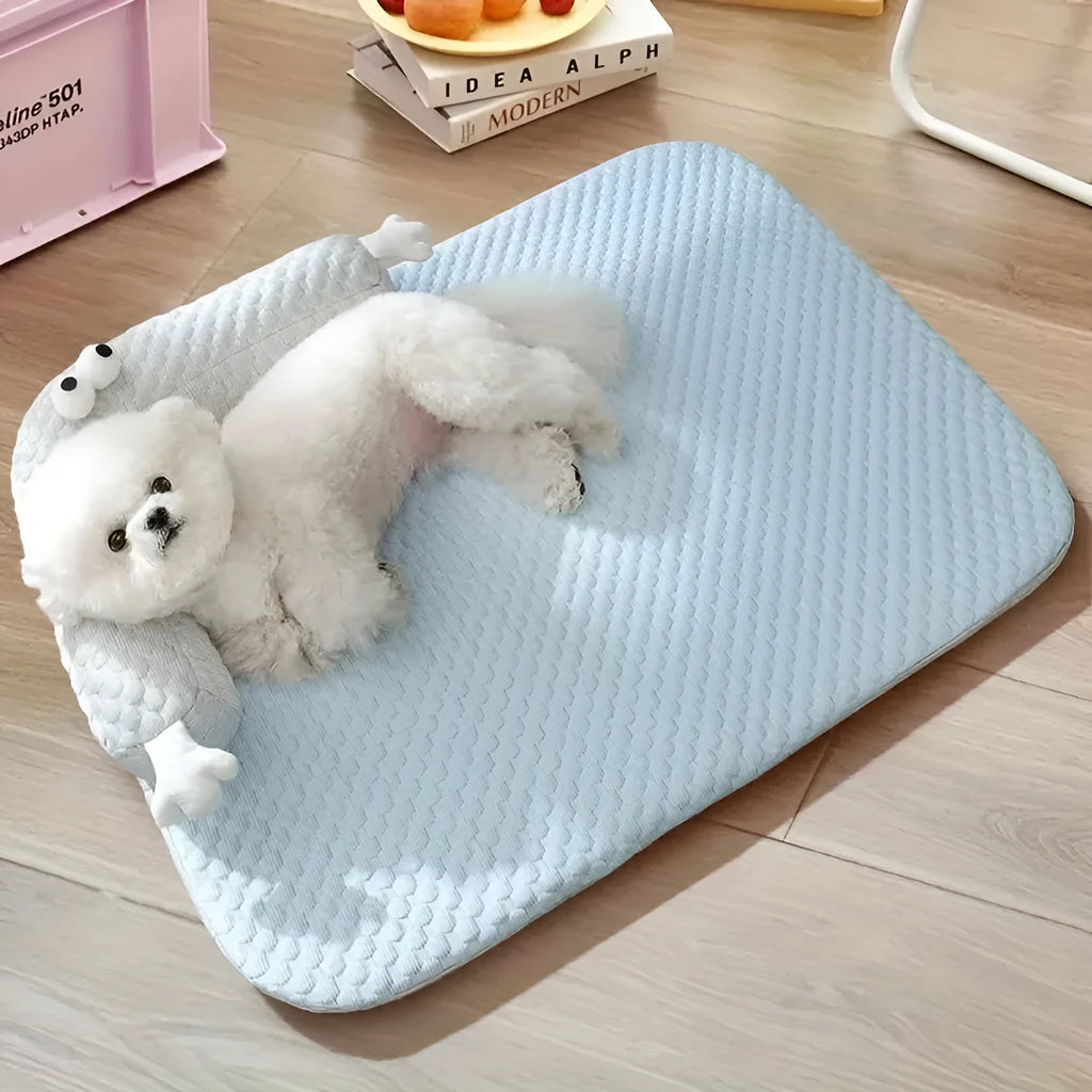 Blue big-eyed monster design pet bed cushion showing non-slip base and raised sofa style construction