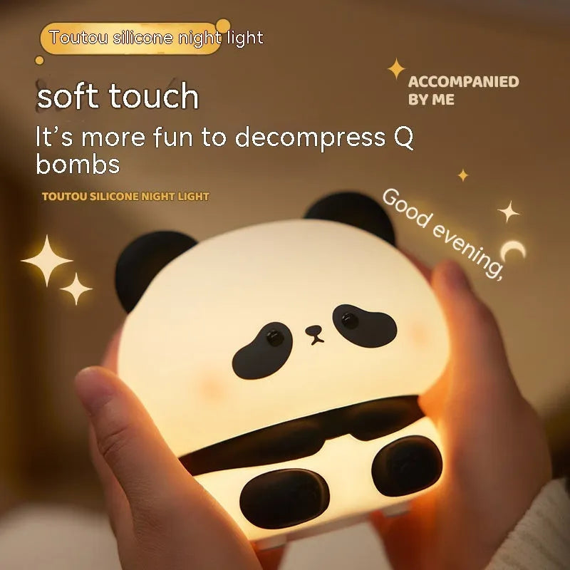 Panda LED night light with soft silicone head and colourful glow on a wooden table