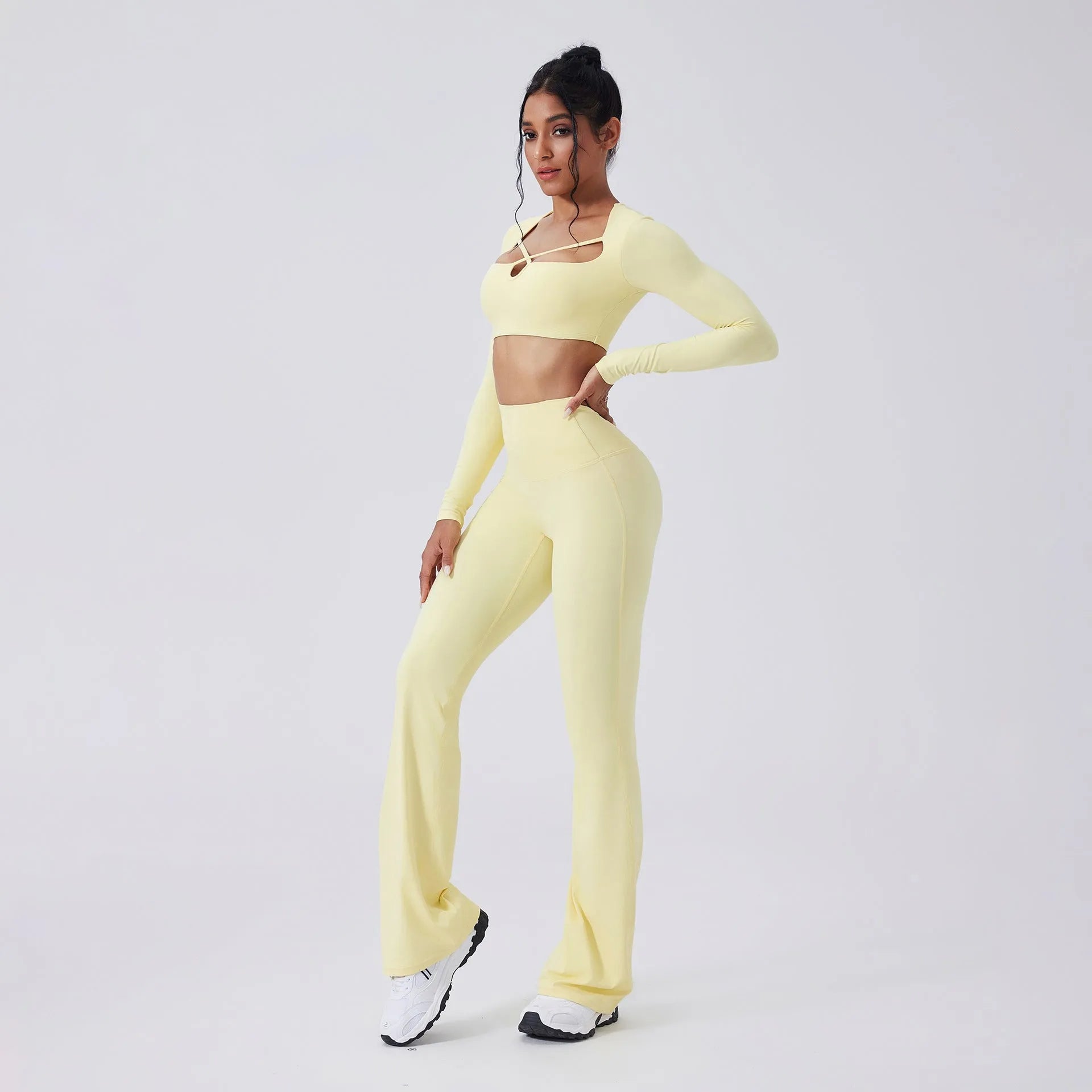 Color-blocking yoga set with hollow-out top and high-waist flared pants in Egret White, black, light banana, espresso, navy peony