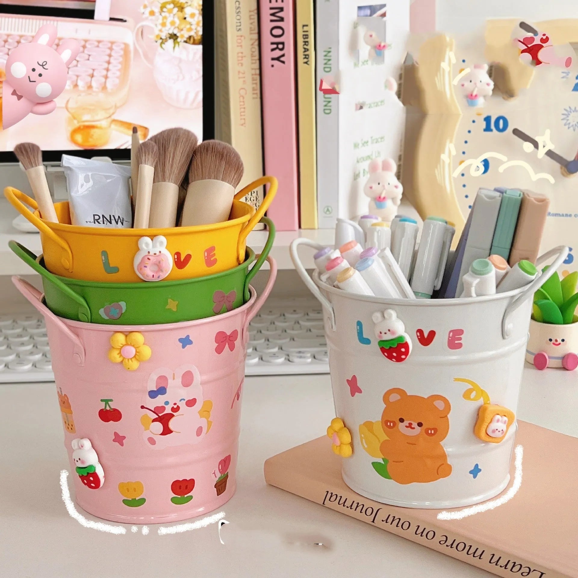 Round metal desktop pen holder showing colour options including green, pink, red, white and yellow