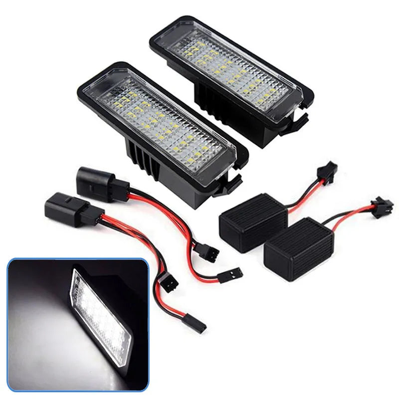 Two Volkswagen LED license plate light units with multiple white SMD LEDs visible.