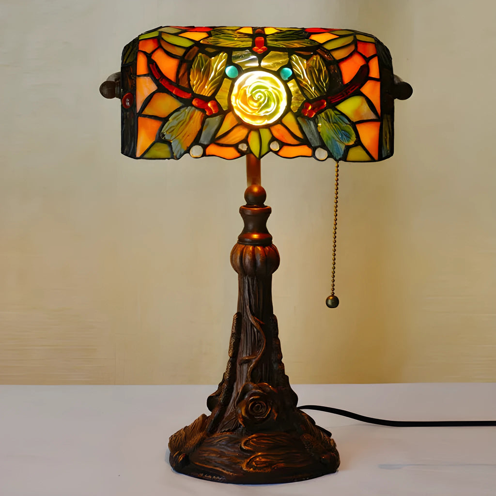 10-inch Tiffany stained glass table lamp with resin base on a wooden desk.